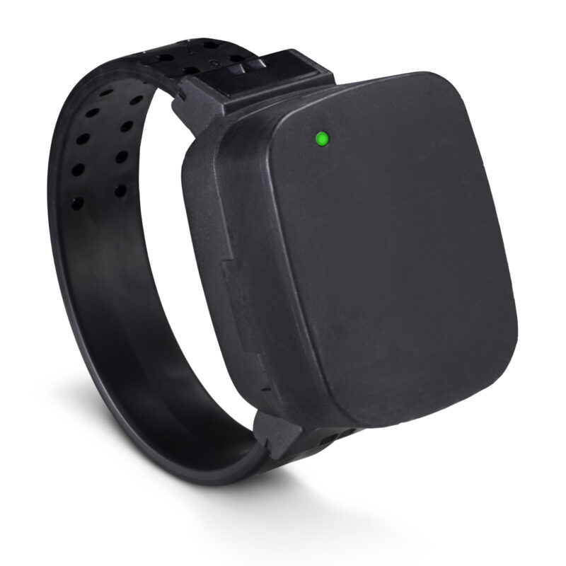 Wrist-worn location tracker with slide-on recharger