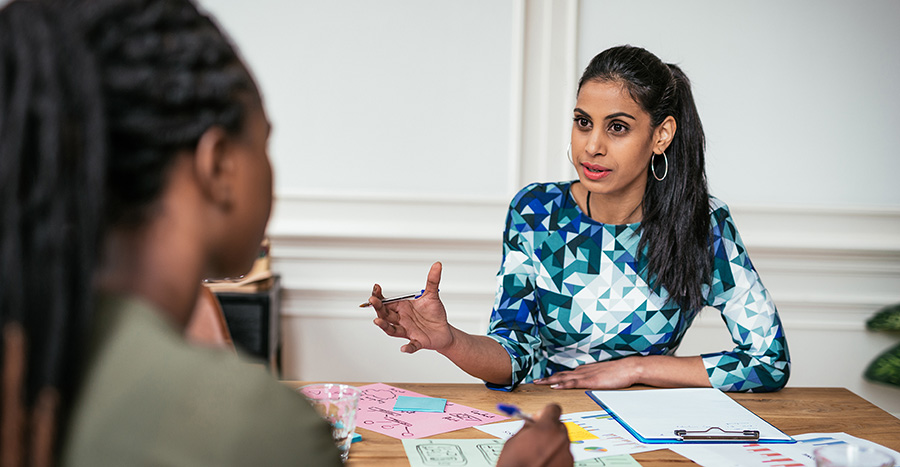 Pretrial officer meeting with female client to discuss case support.